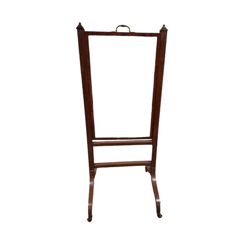 43 - A GEORGIAN MAHOGANY CHEVAL MIRROR the rectangular plate within a fall and rise frame with brass hand... 