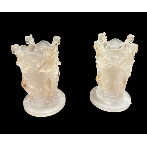 154 - A PAIR OF LALIQUE STYLE TABLE LAMPS of irregular outline decorated with females to the angles on a c... 