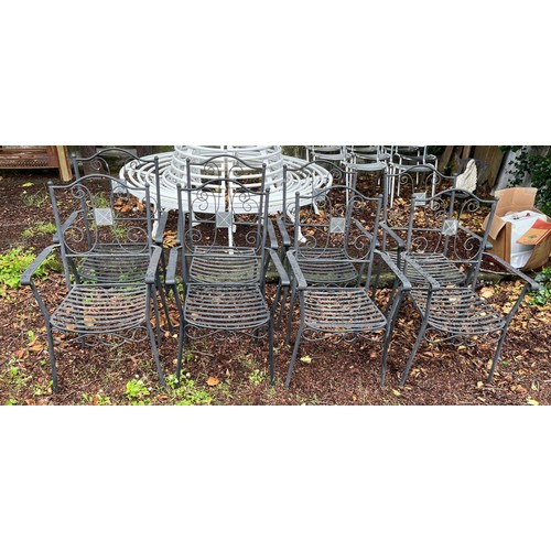 720 - A SET OF EIGHT WROUGHT IRON PATIO CHAIRS each with a curved top rail and scroll splat with slatted s... 