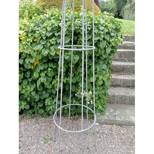 501 - A PAIR OF WROUGHT IRON OBELISKS each of tapering form with fleur de lis finials 290cm (h) x 49cm (d)