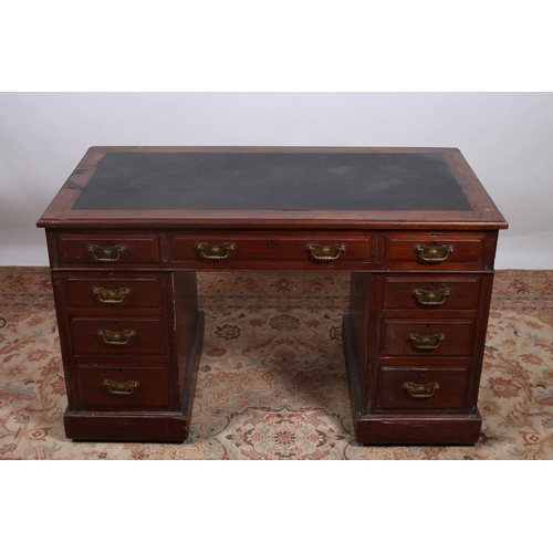 90 - AN EDWARDIAN MAHOGANY PEDESTAL DESK of rectangular outline the shaped top with rexine inset above th... 