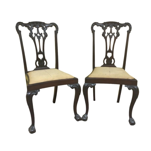 221 - A PAIR OF 19TH CENTURY CHIPPENDALE DESIGN CARVED MAHOGANY SIDE CHAIRS each with a shaped top rail an... 