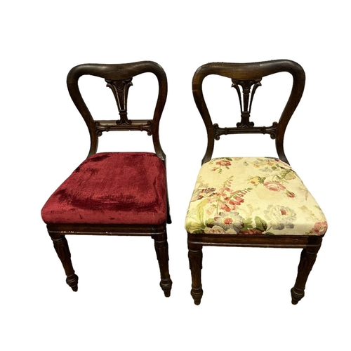 714 - A PAIR OF 19TH CENTURY ROSEWOOD SIDE CHAIRS each with a curved top rail and pierced vertical splats ... 