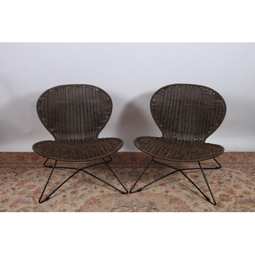 720 - A PAIR OF SIMULATED CANE AND WROUGHT IRON CHAIRS each with an oval back and seat on tubular legs