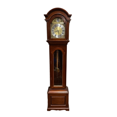 1 - A MAHOGANY LONG CASED CLOCK the arched hood with silvered and brass dial with Roman numerals above a... 