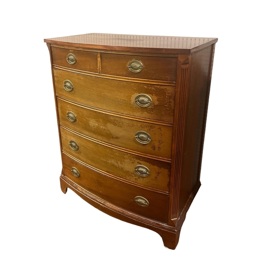 152 - A GEORGIAN STYLE MAHOGANY BOW FRONT CHEST of two short and four long graduated drawers on bracket fe... 