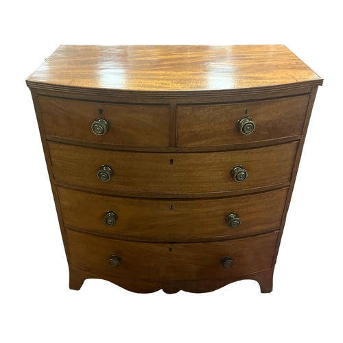 154 - A GOOD GEORGIAN MAHOGANY BOW FRONT CHEST of two short and three long drawers with brass handles on b... 