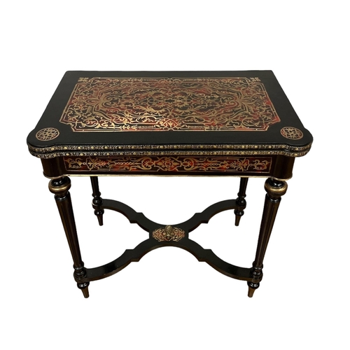 183 - AN EBONISED RED BOULLE AND BRASS INLAID FOLDOVER CARD TABLE the rectangular hinged top on fluted tap... 