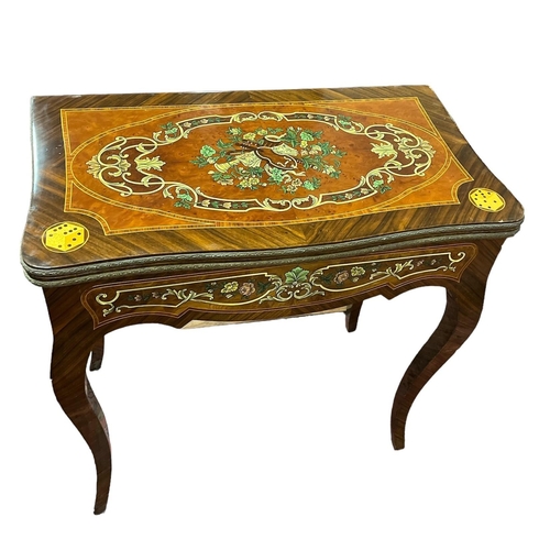 185 - A CONTINIENTAL KINGWOOD AND MARQUETRY FOLDOVER CARD TABLE with shaped apron on sabre legs 79cm (h) x... 