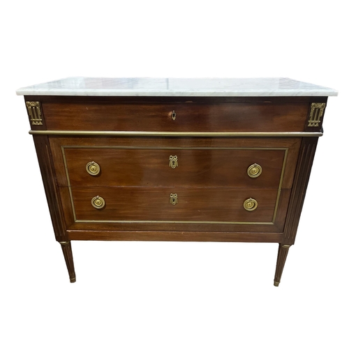 189 - A CONTINENTAL MAHOGANY AND GILT BRASS MOUNTED CHEST surmounted by a white veined marble top above fo... 