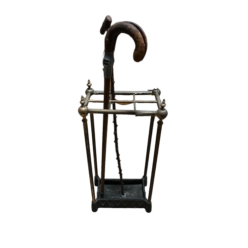 190 - A VINTAGE BRASS AND CAST IRON SIX COMPARTMENT STICK STAND 63cm (h) x 32cm (w) x 20cm (d) together wi... 