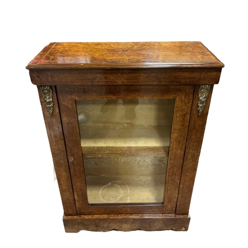 193 - A 19TH CENTURY BURR WALNUT AND GILT BRASS MOUNTED PIER CABINET with glazed door on platform support ... 