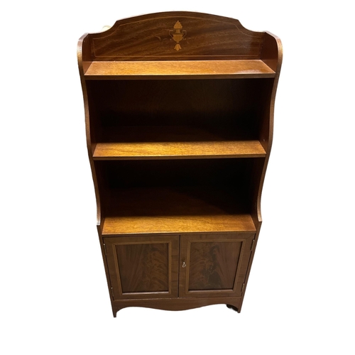 199 - A SHERATON STYLE MAHOGANY INLAID THREE TIER GRADUATED OPEN FRONT BOOK SHELF with cupboard on shaped ... 