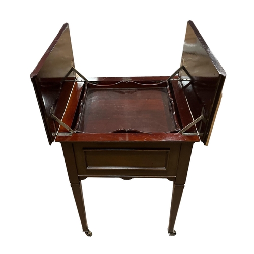 222 - AN EDWARDIAN MAHOGANY DRINKS TABLE the hinged top containing a glazed central tray bears label 'Best... 