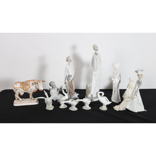 242 - FOUR LLADRO FIGURES, a Spode China figure, etc.