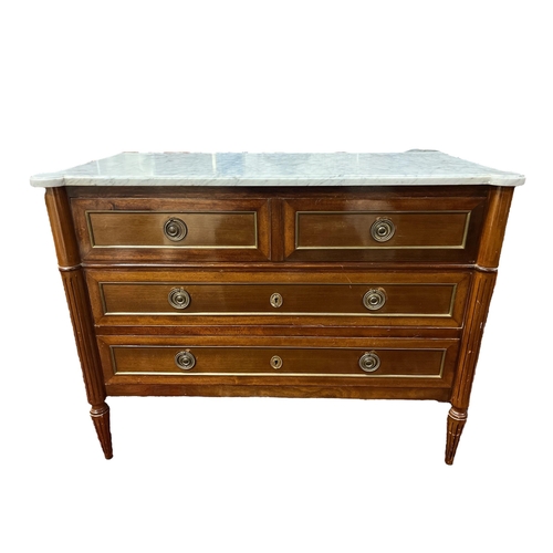 256 - A CONTINENTAL MAHOGANY AND GILT BRASS MOUNTED CHEST surmounted by a white veined marble top with two... 