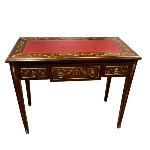 39 - A CONTINENTAL KINGWOOD INLAID AND GILT BRASS MOUNTED DESK with three frieze drawers on square taperi... 