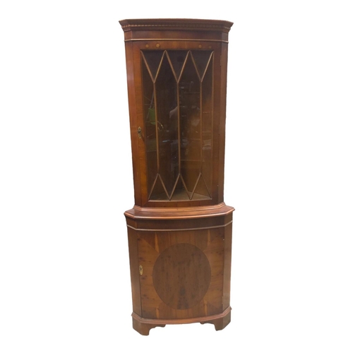 5 - A YEW WOOD BOW FRONT CORNER CABINET 182cm (h) x 165cm (w) x 42cm (d)