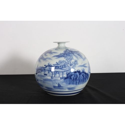 544 - A CHINESE BLUE AND WHITE VASE of bulbous form the white ground decorated with pagodas in landscape 2... 