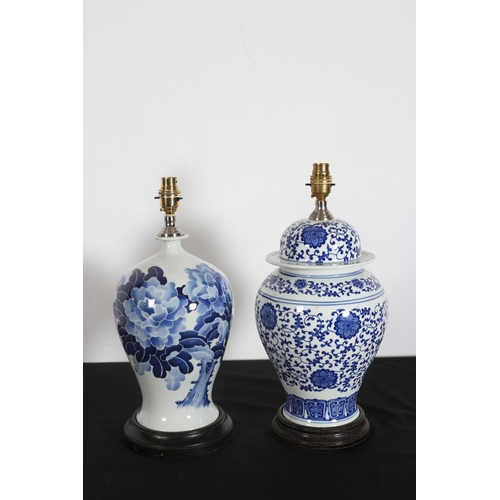 561 - TWO BLUE AND WHITE PORCELAIN TABLE LAMPS each of baluster form on hardwood stands 140cm (h), 138cm (... 