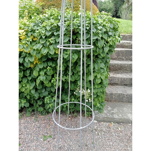 655 - A PAIR OF WROUGHT IRON OBELISKS each of cylindrical spreading form with fleur de lis mounts 210cm (h... 