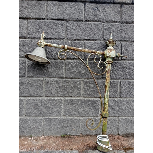 657 - A VICTORIAN CAST IRON AND WROUGHT IRON STREET LAMP with scroll decoration 128cm (h) x 27cm (w) x 115... 