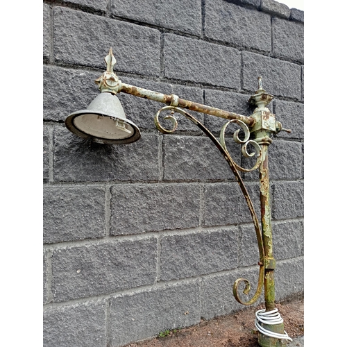 657 - A VICTORIAN CAST IRON AND WROUGHT IRON STREET LAMP with scroll decoration 128cm (h) x 27cm (w) x 115... 