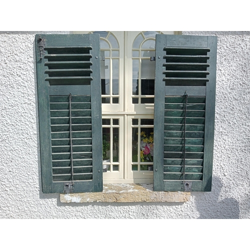 661 - A PAIR OF FRENCH PINE PAINTED LOUVRES with metal strap hinges 134cm (h) x 105cm (w) x 5cm (d)