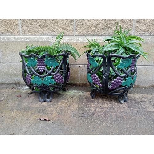 665 - A PAIR OF CAST IRON AND POLYCHROME OPENWORK BASKETS with vine decoration 30cm (h) x 34cm (d)