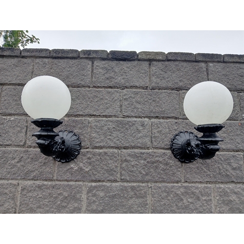 666 - A PAIR OF CAST ALUMINIUM WALL SCONCES with globe shades 50cm (h) x 25cm (w) x 50cm (d)