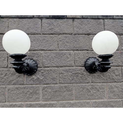 666 - A PAIR OF CAST ALUMINIUM WALL SCONCES with globe shades 50cm (h) x 25cm (w) x 50cm (d)