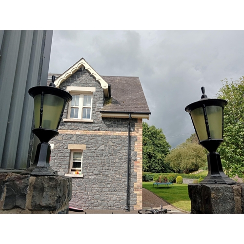 684 - A PAIR OF CAST ALUMINIUM OUTSIDE PIER LIGHTS each of cylindrical tapering form 56cm (h) x 26cm (d)