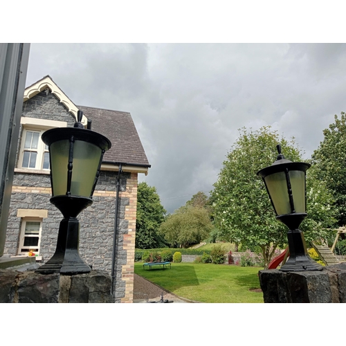 684 - A PAIR OF CAST ALUMINIUM OUTSIDE PIER LIGHTS each of cylindrical tapering form 56cm (h) x 26cm (d)