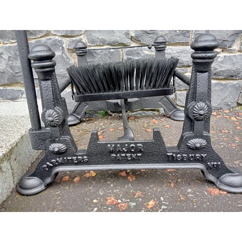 689 - A CAST IRON FOOT SCRAPE with brush and scrape on pad feet 97cm (h) x 54cm (w) x 44cm (d)