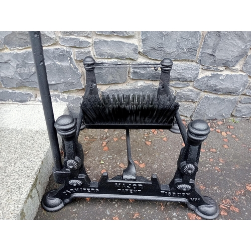 689 - A CAST IRON FOOT SCRAPE with brush and scrape on pad feet 97cm (h) x 54cm (w) x 44cm (d)