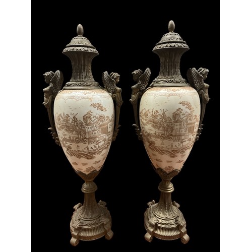 173 - A PAIR OF CONTINENTAL PORCELAIN AND GILT BRASS MOUNTED LIDDED VASES each of ovoid tapering form the ... 