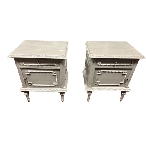 601 - A PAIR OF CONTINENTAL GREY PAINTED PEDESTALS with frieze drawer and cupboards on fluted and turned l... 