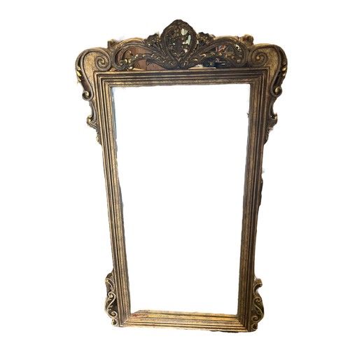 602 - A CONTINENTAL GILT FRAME MIRROR with pierced foliate and C-scroll cresting within a reeded frame 102... 