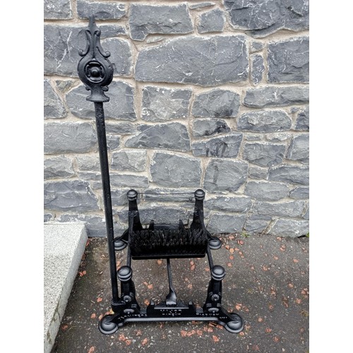 689 - A CAST IRON FOOT SCRAPE with brush and scrape on pad feet 97cm (h) x 54cm (w) x 44cm (d)