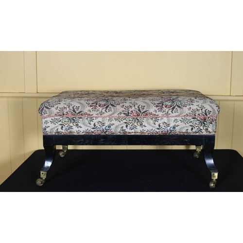 46 - A VINTAGE EBONISED AND UPHOLSTERED STOOL the rectangular upholstered seat above a moulded apron with... 