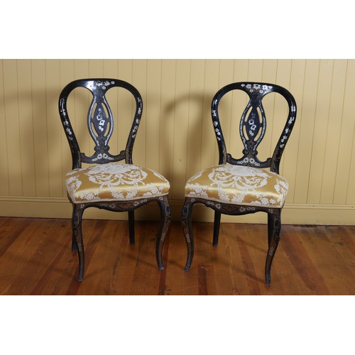 71 - A PAIR OF VINTAGE BLACK LACQUERED POLYCHROME AND GILT SIDE CHAIRS each with a curved back with pierc... 