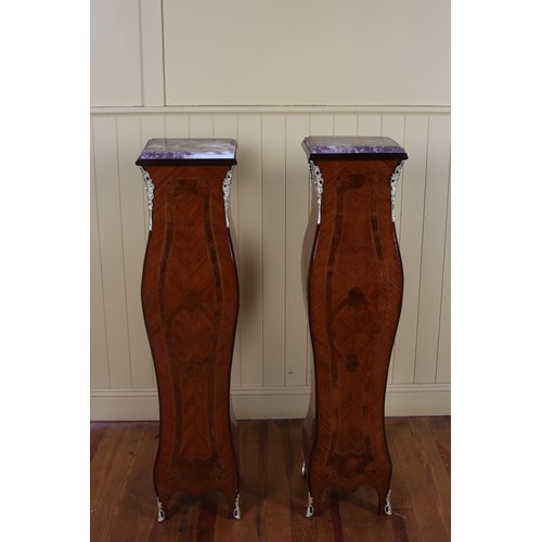 77 - A PAIR OF CONTINENTAL KINGWOOD INLAID AND GILT BRASS MOUNTED COLUMNS each with a rectangular veined ... 