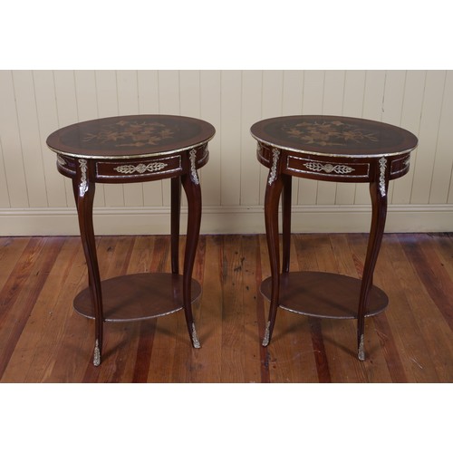 181 - A PAIR OF CONTINENTAL KINGWOOD MARQUETRY AND GILT BRASS MOUNTED TABLES of oval outline on sabre legs... 