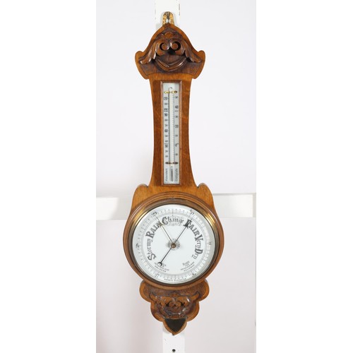 224 - AN EDWARDIAN CARVED OAK BANJO ANEROID BAROMETER AND THERMOMETER 82cm (h) x 27cm (w)