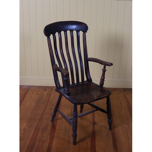 209 - A VINTAGE ELMWOOD ELBOW CHAIR the curved top rail with slatted back with shaped seat and moulded arm... 