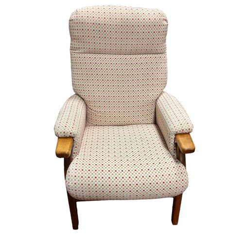 251 - A VINTAGE BEECHWOOD AND UPHOLSTERED ARMCHAIR with upholstered arm rests on moulded legs