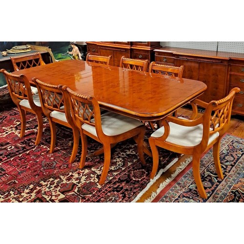 282 - A YEW WOOD NINE PIECE DINING ROOM SUITE comprising EIGHT CHAIRS, including a pair of elbow chairs, D... 