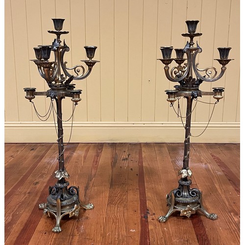 114 - A PAIR OF 19TH CENTURY GILT BRASS AND PLATED SEVEN BRANCH CANDELABRA with pierced C-scroll arms with... 