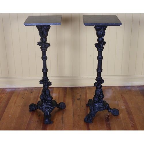 600 - A PAIR OF CAST IRON AND MARBLE JARDINIERE STANDS each with a fluted column on tripod support with sc... 