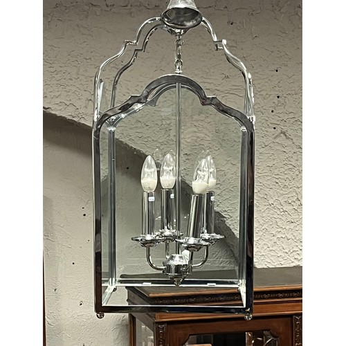 179 - A CHROME THREE LIGHT LANTERN of rectangular form with arched glazed panels 60cm drop x 29cm (w) x 29... 